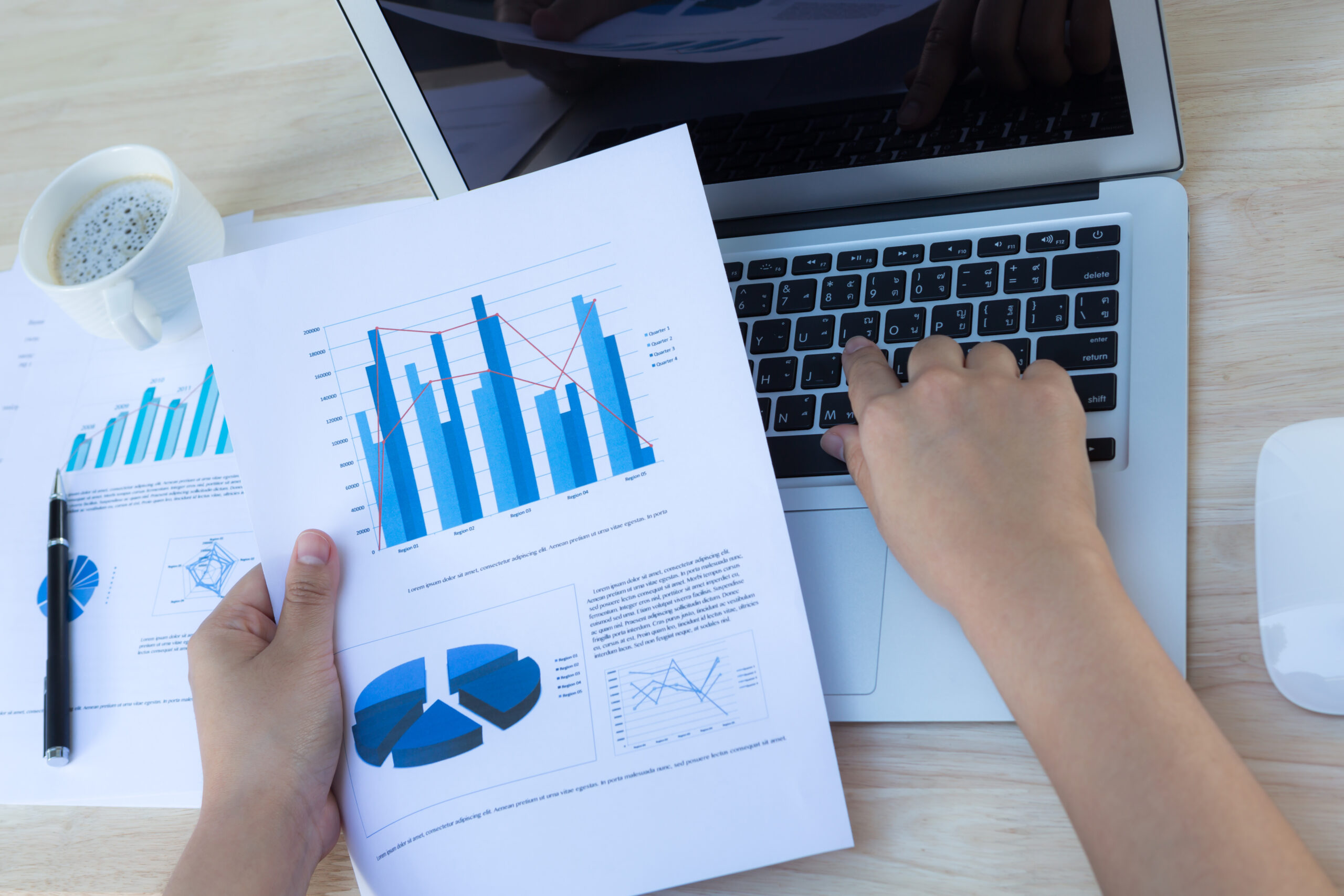 Business graphs and digital reports showcasing insights delivered by our B2B data analytics services